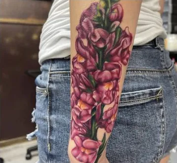 Color realism snapdragon flowers on the forearm